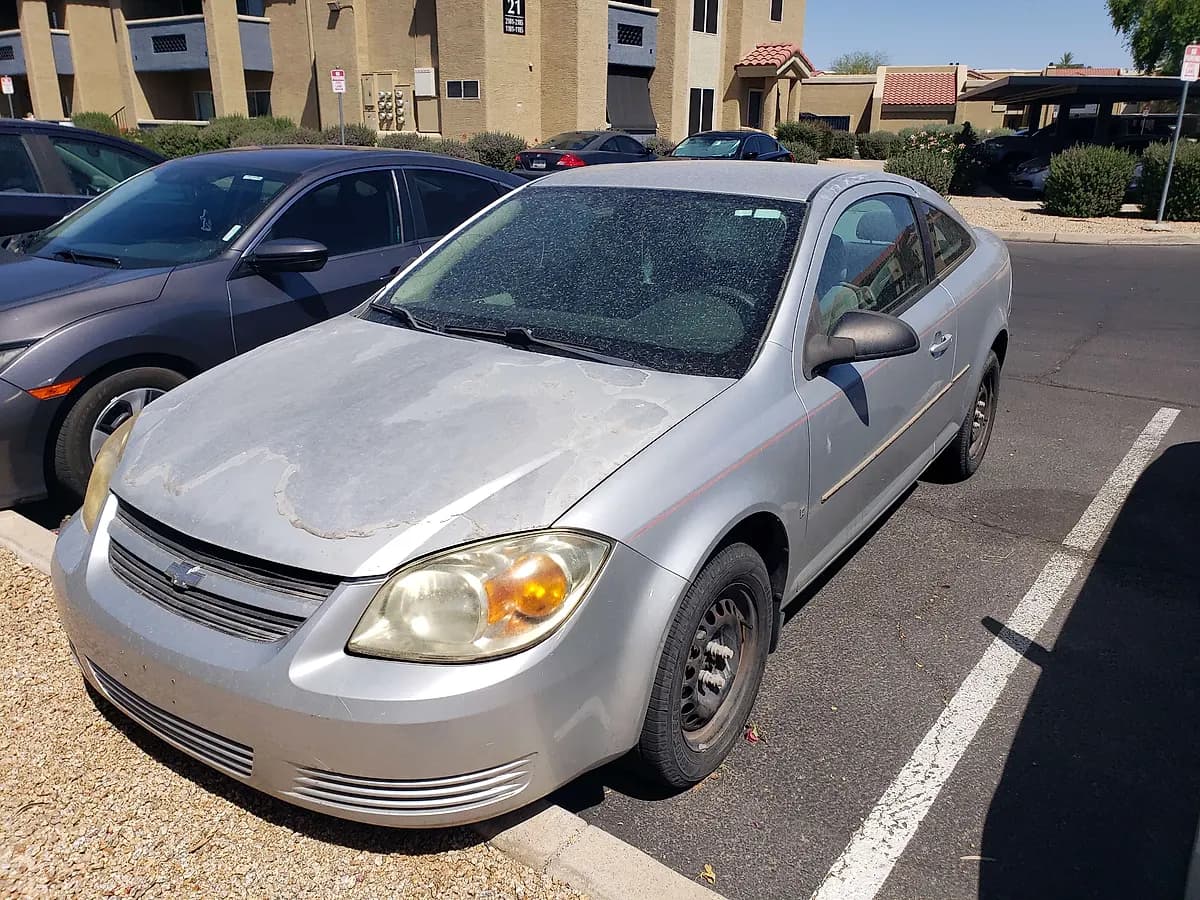 Silver 2008 Chevrolet Cobalt LT coupe with peeling hood paint we bought for cash