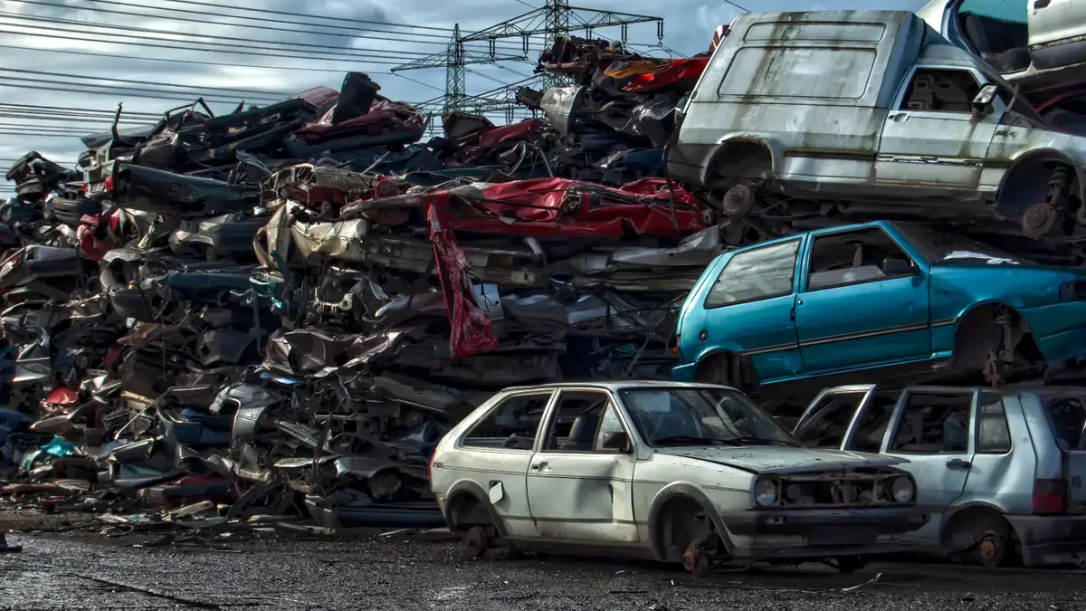 Stacked end-of-life cars at a salvage yard