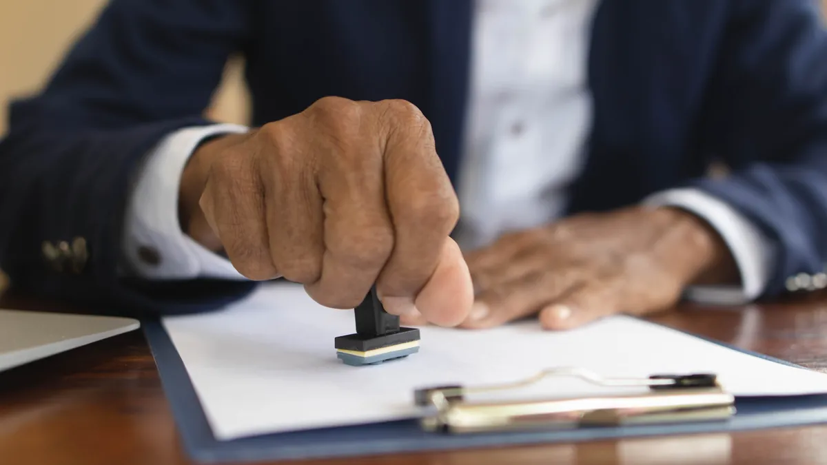 Stamping an approved New York vehicle title application