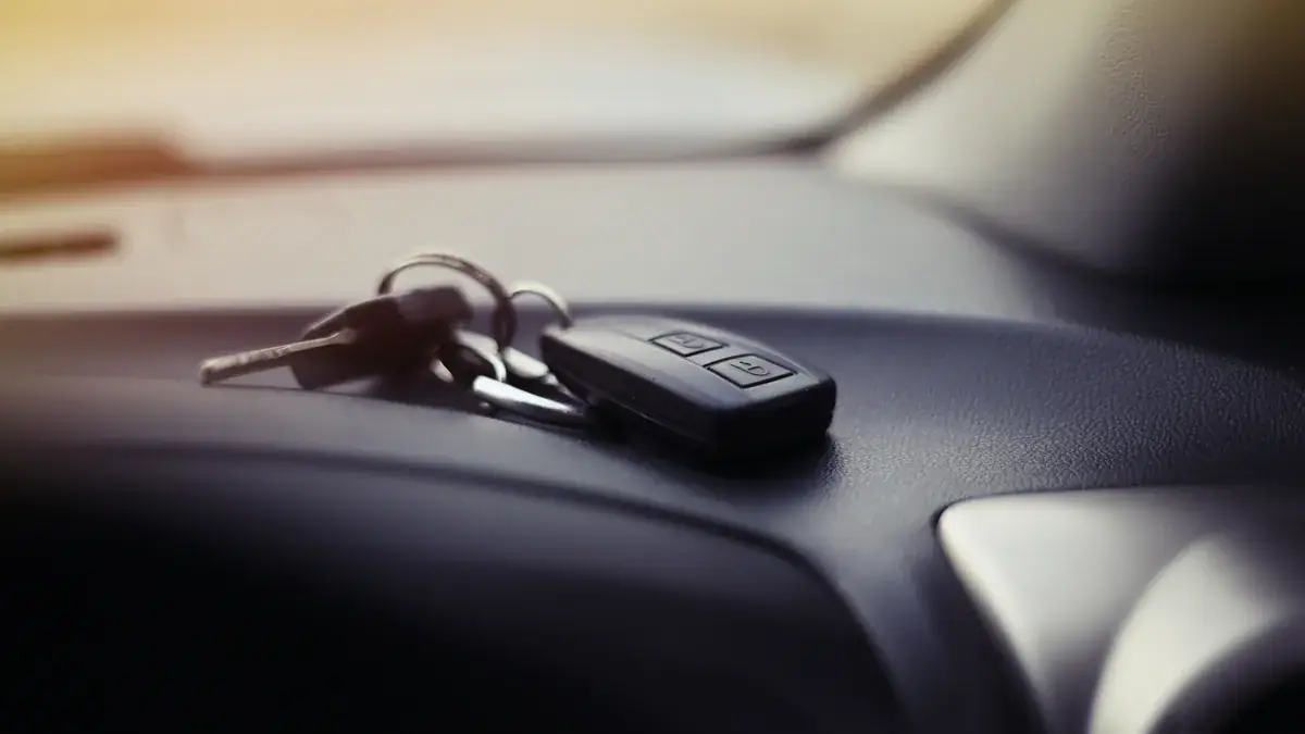 Car keys resting on a vehicle seat