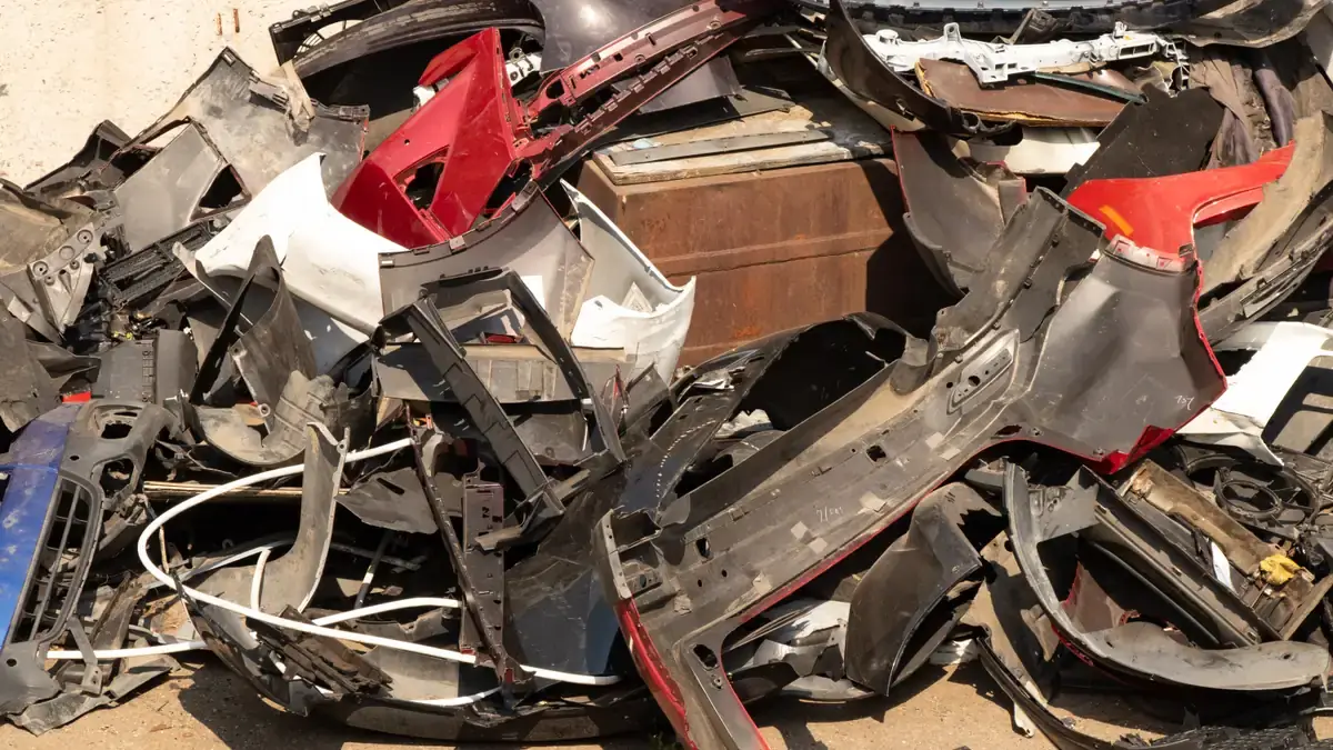 Crushed and baled scrap cars at a metal recycler