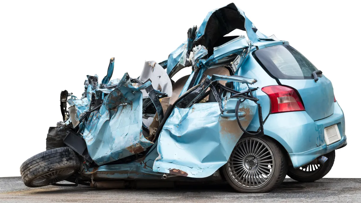 A heavily damaged car of the kind that earns a salvage brand