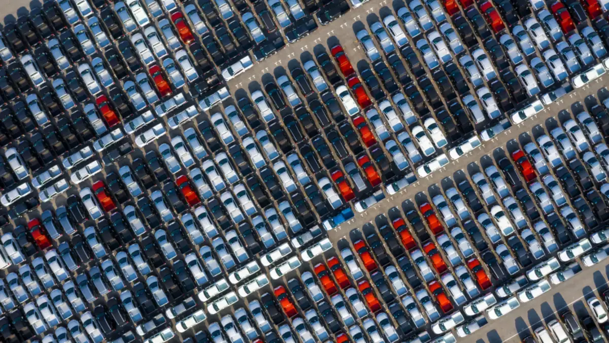 Rows of cars lined up at a vehicle lot