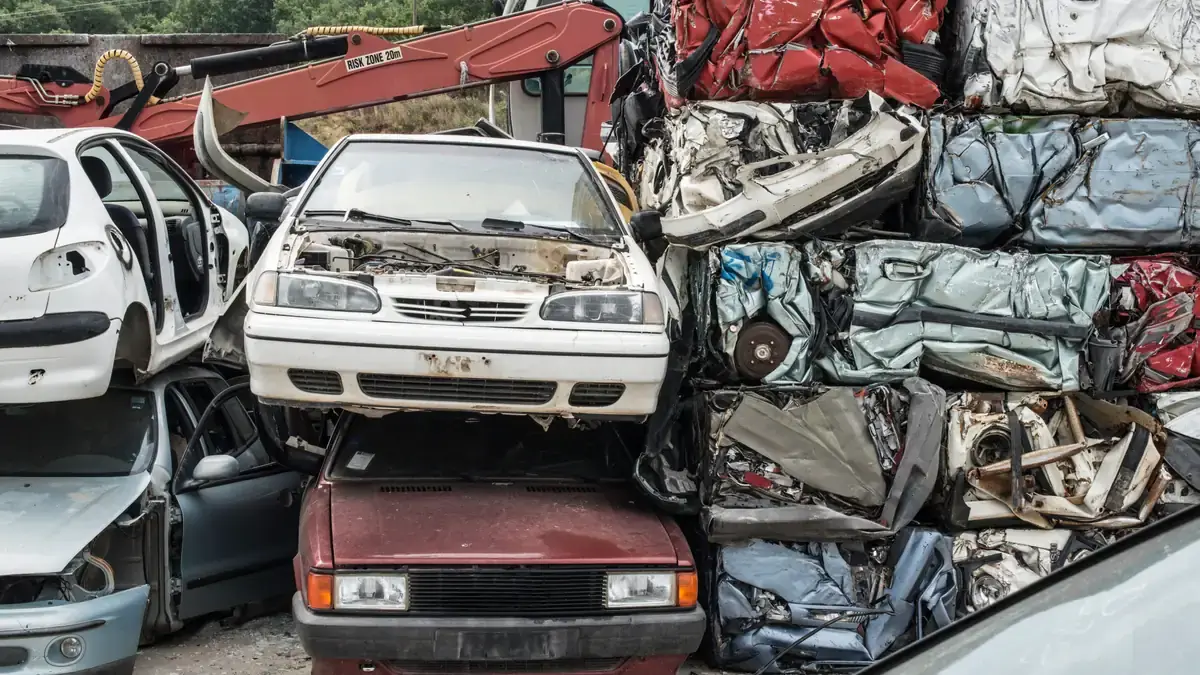 Baled scrap cars ready for the shredder