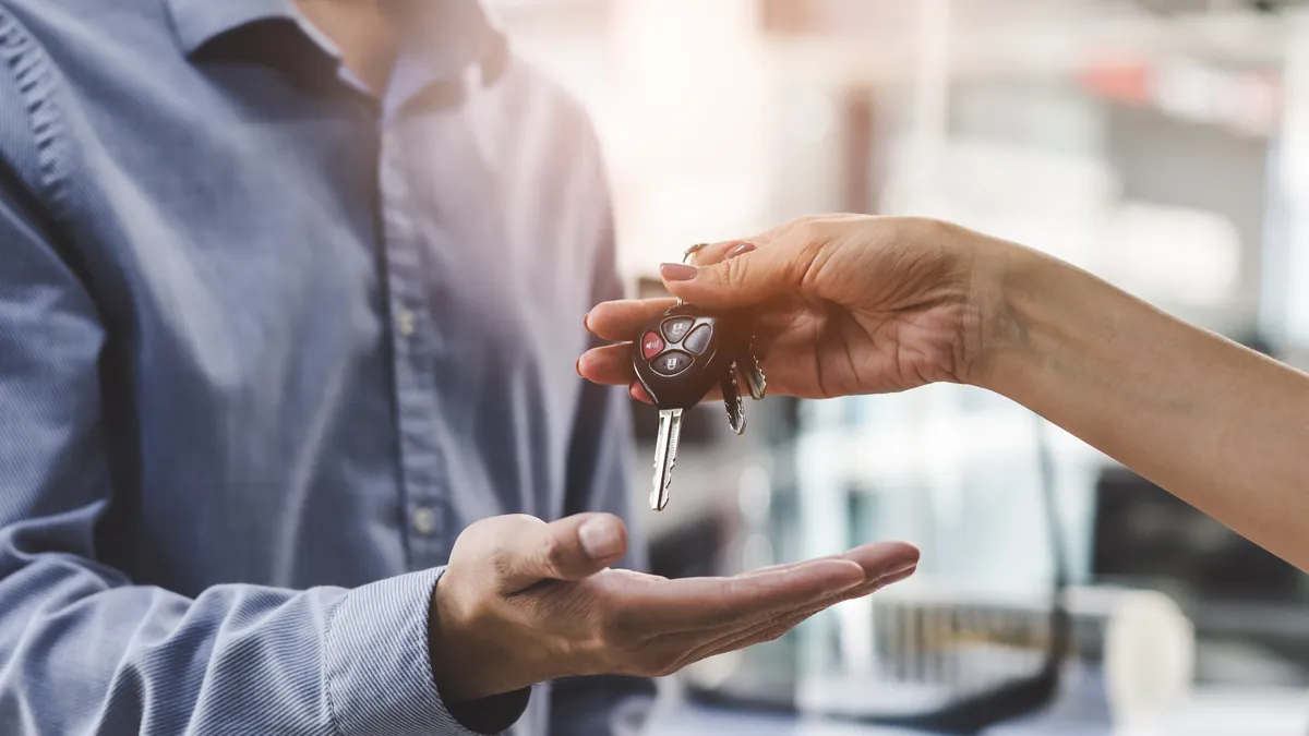 Handing over keys with vehicle documents