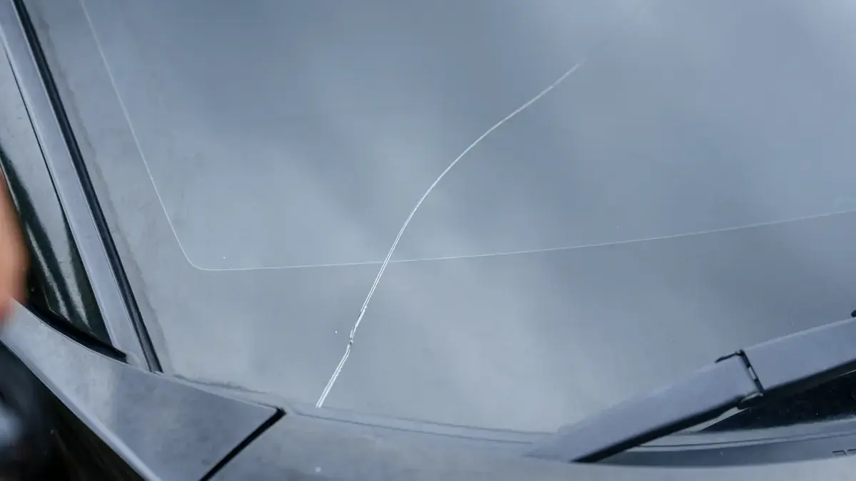 A cracked windshield awaiting replacement
